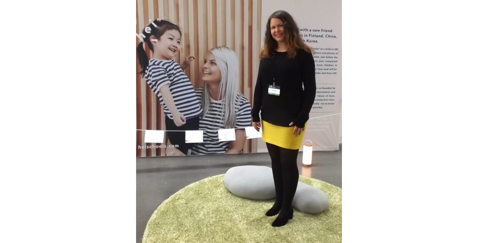 Milla Kokko shows off HEI School’s display at the Second Nordic Innovation Summit in Seattle